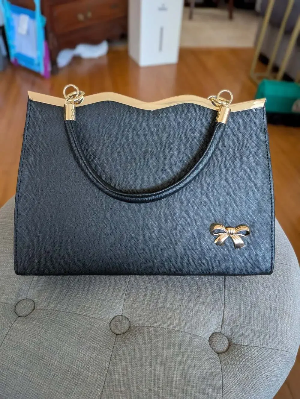 Black Saffiano Leather Handbag Satchel with Gold Bow Accent and Metal Trim